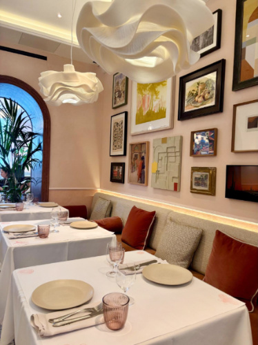 View of tables and chairs inside LEYDI