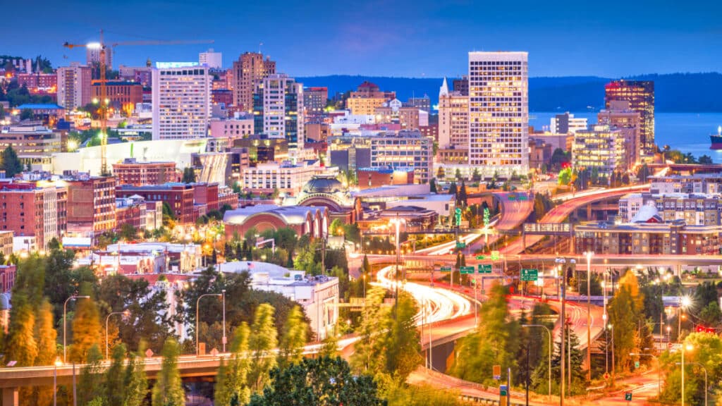 View of the illuminated Tacoma skyline and highway at night
