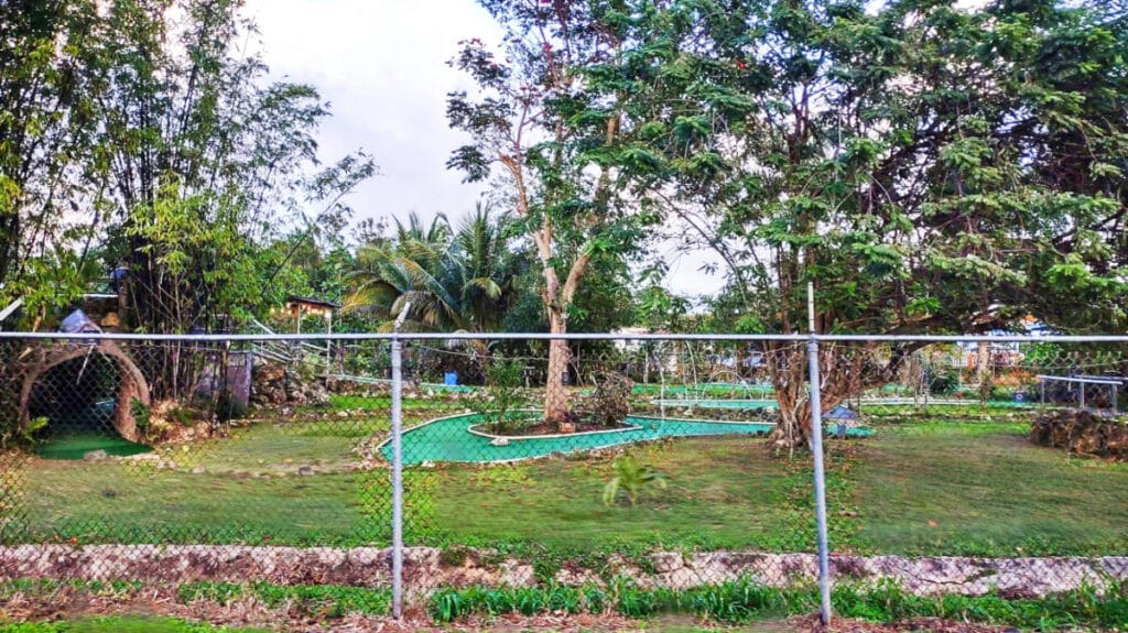 View of the Taíno-themed mini golf course from across the fence