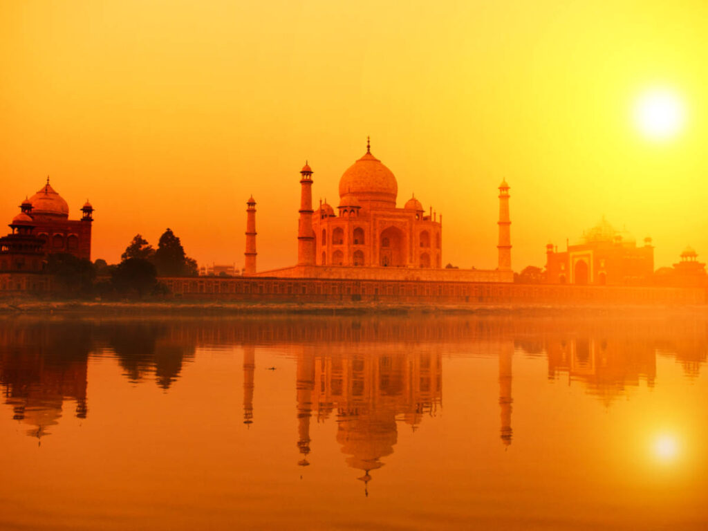Scenic sunset view over the Taj Mahal reflecting on the water