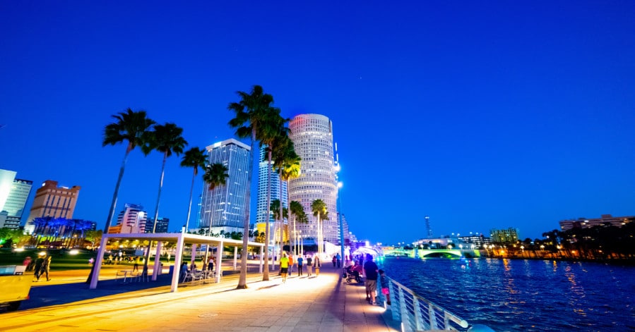 Pedestrians strolling the Tampa Bay riverwalk