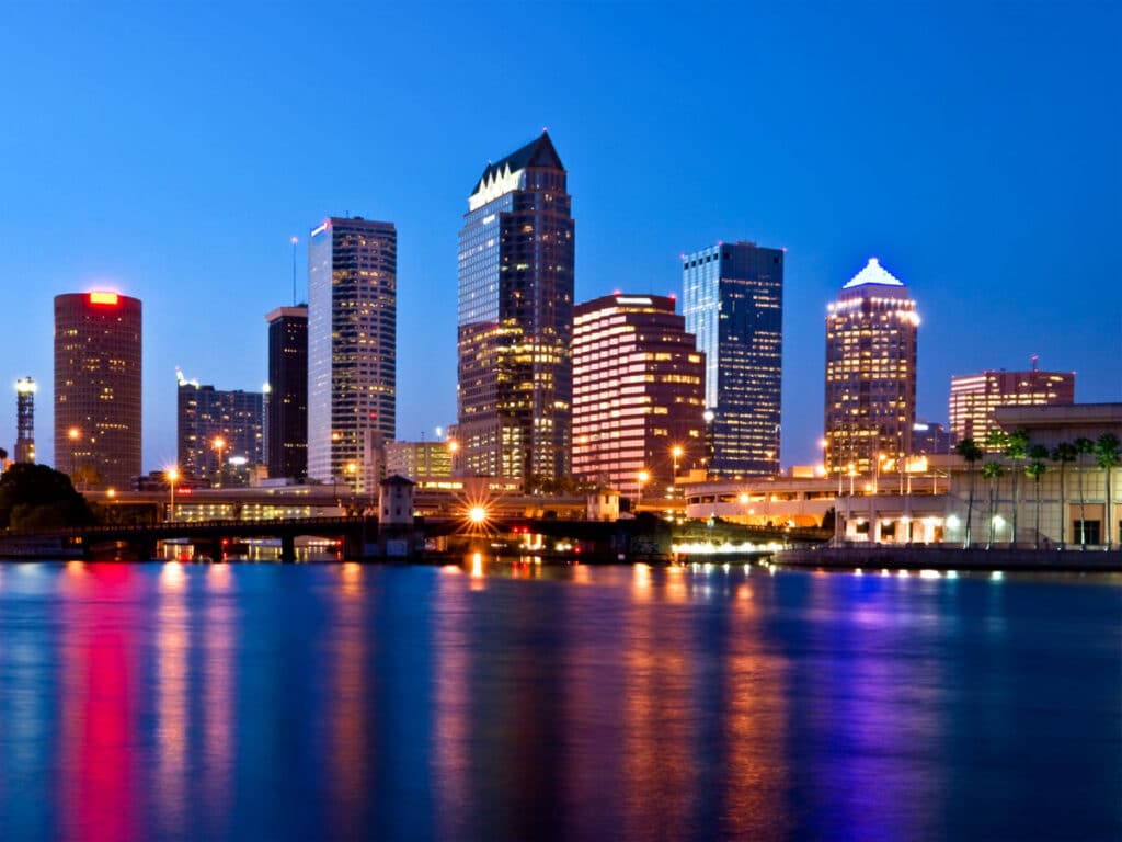 Scenic view of Tampa skyline reflecting on the water at night