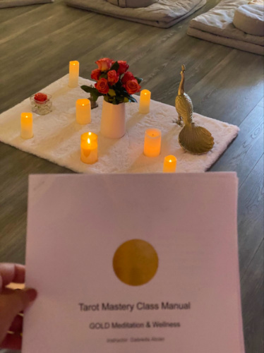 Lighted candles on the floor for the Tarot Mastery Class