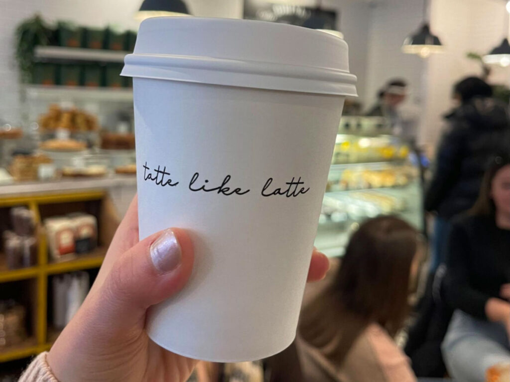 Holding a cup of Tatte House Latte