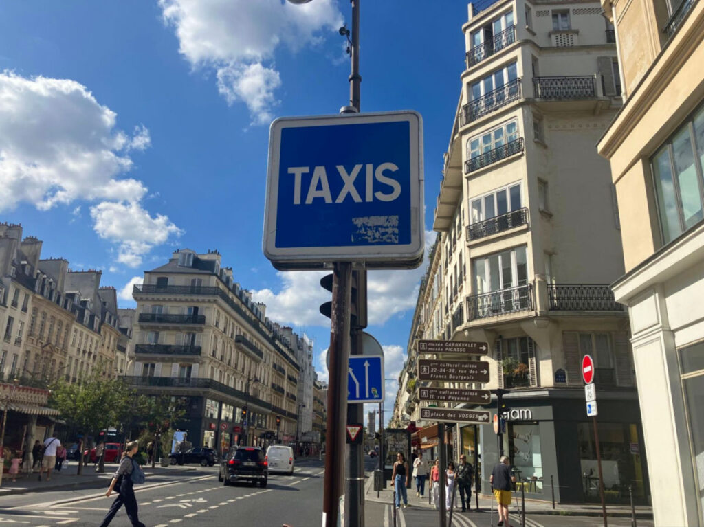 Taxi sign on the street of Paris