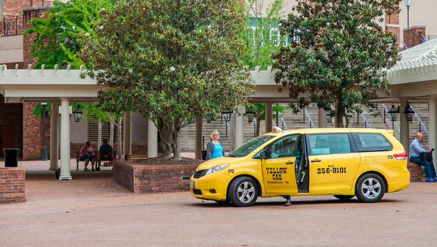 A taxi picking up a passenger in Nashville