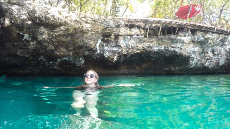 The author Taylor Herperger swimming at Cenote Jardin del Eden