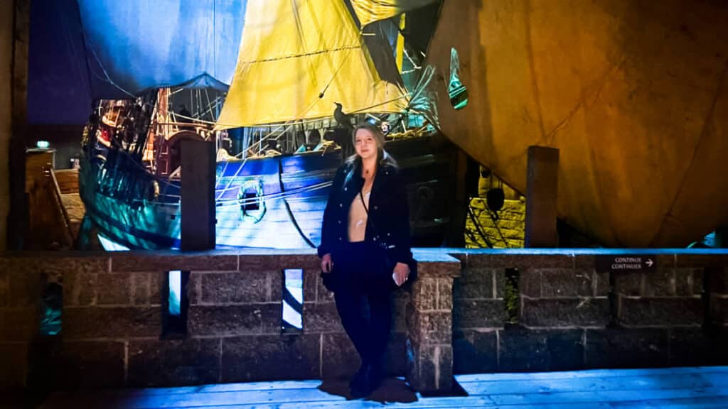 The author, Taylor Herperger posing at the Manitoba Museum with the ship behind her