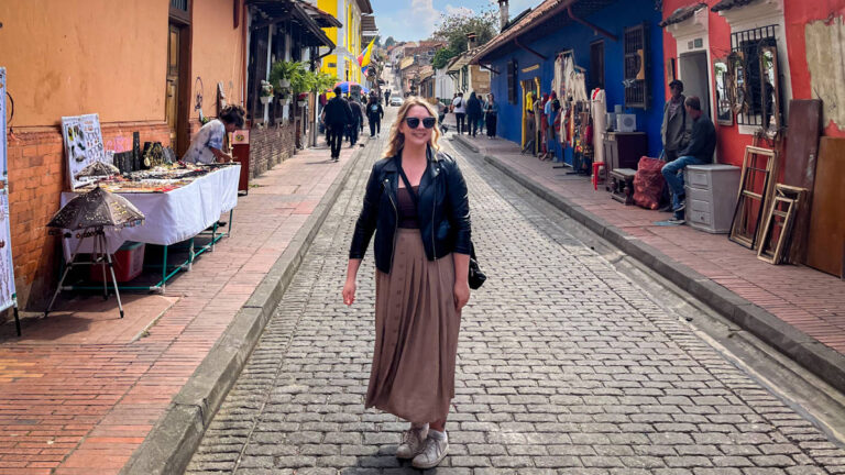 The author Taylor Herperger, posing for a photo in the middle of the street in Bogota