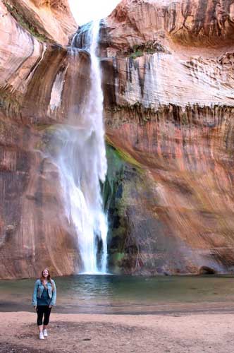 Travel Lemming editor Taylor and the Lower Calf Creek Falls on her background