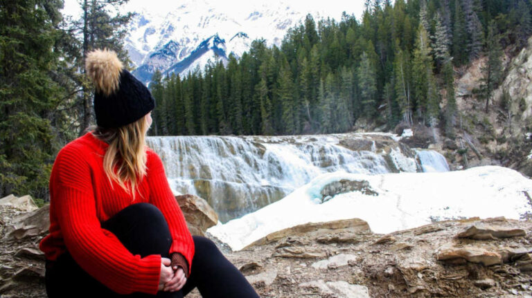 The author Taylor Herperger enjoying the mountain and waterfalls view in Yoho National Park