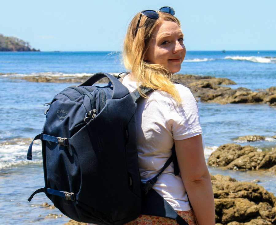 Taylor smiling for a photo with her Osprey Sojourn Porter 30