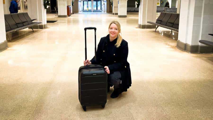 The author holding her Samsonite Omni PC Carry On Spinner