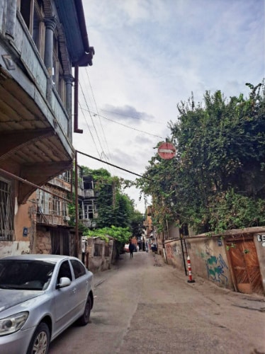 A car parked on a street in Tbilisi Old Town