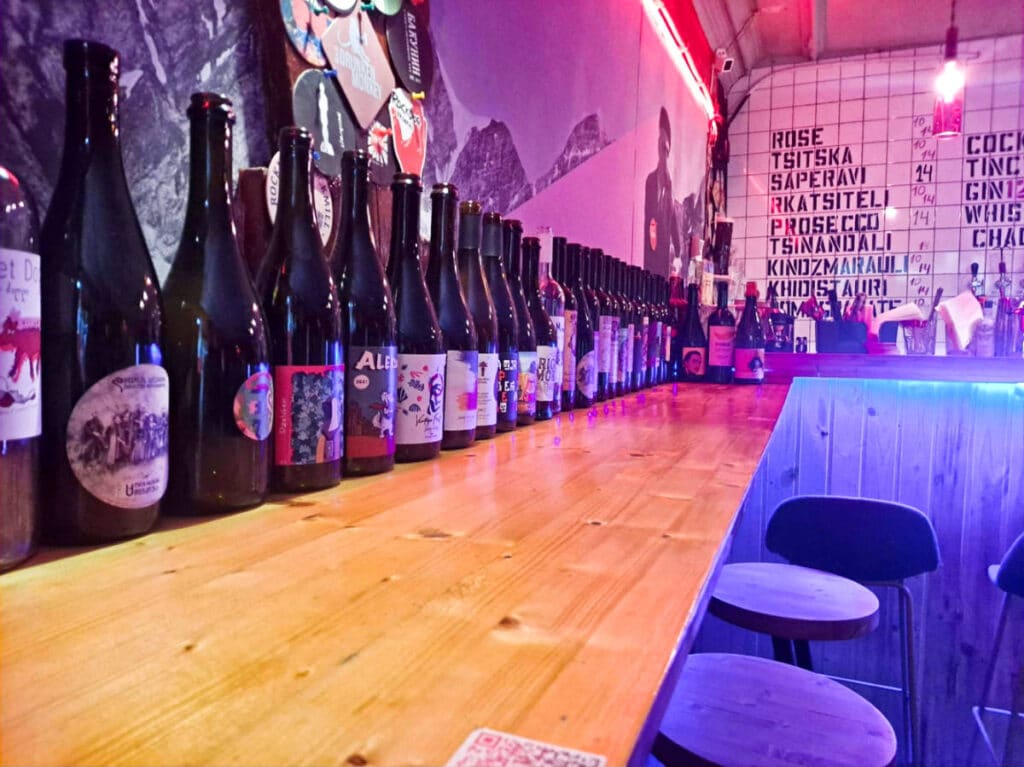 Lined wine bottles inside a bar in Tbilisi