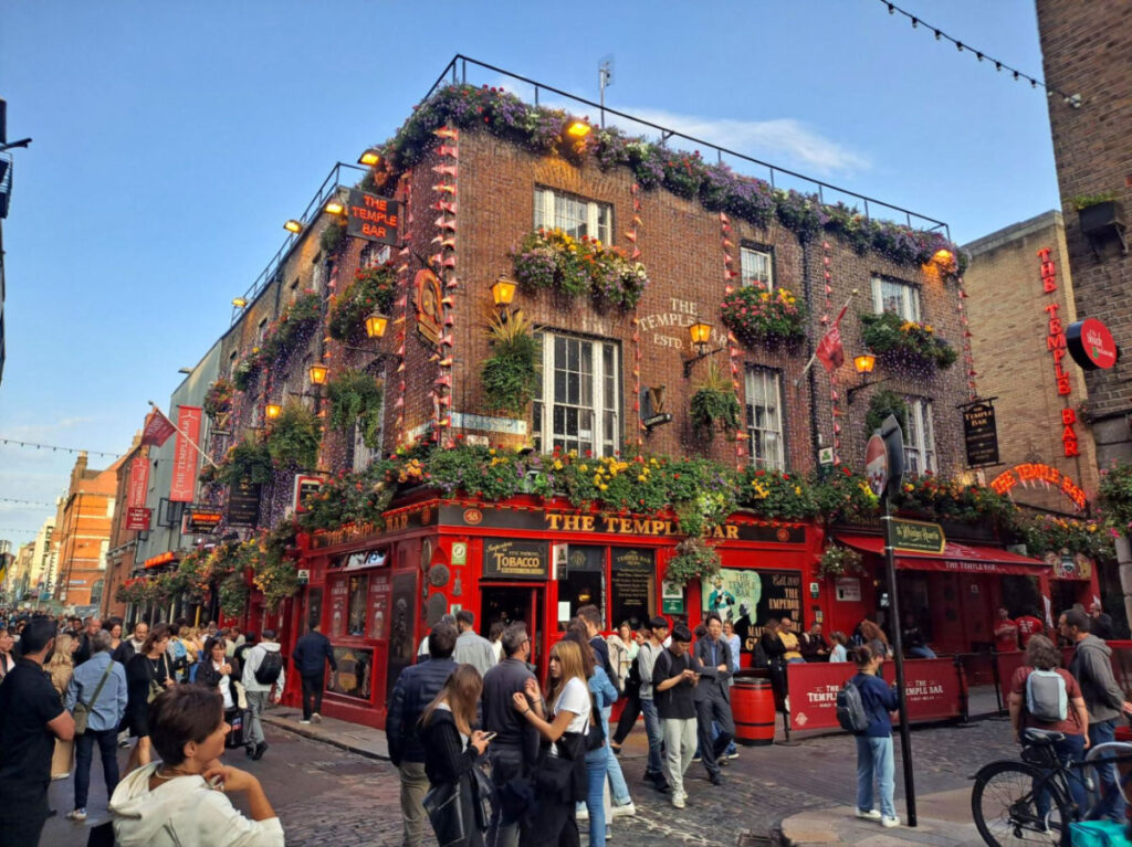 People walking around a street in Temple Bar