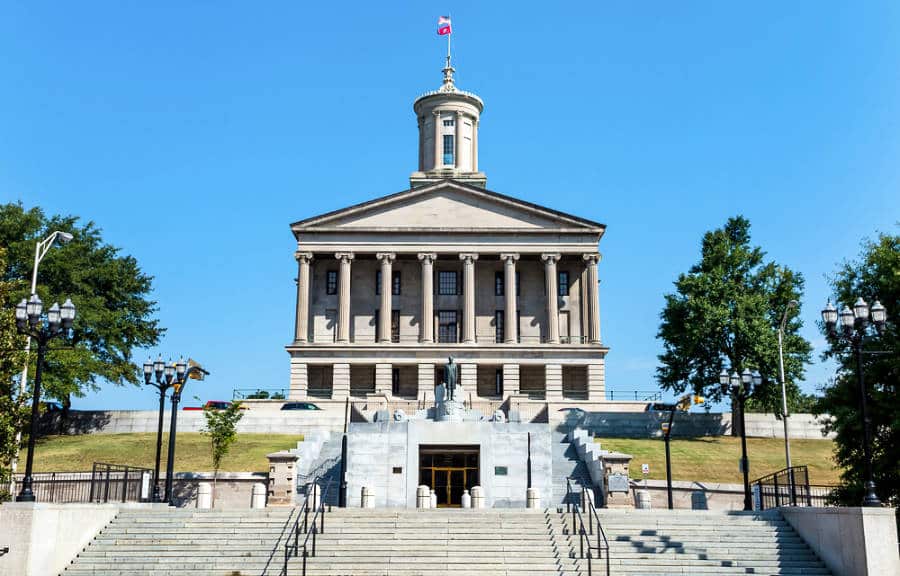 Façade of the Tennessee State Capitol under the clear blue sky in Nashville