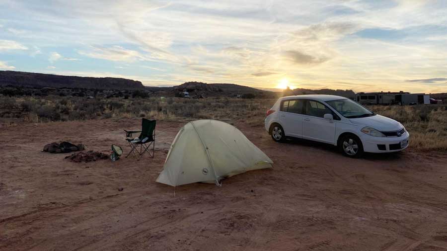 View of a tent and a car during sunrise in California
