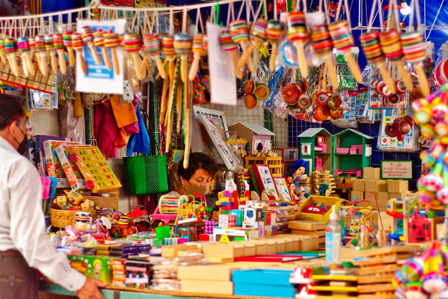 View of a vendor in her wooden toy stand in Tepoztlán Market