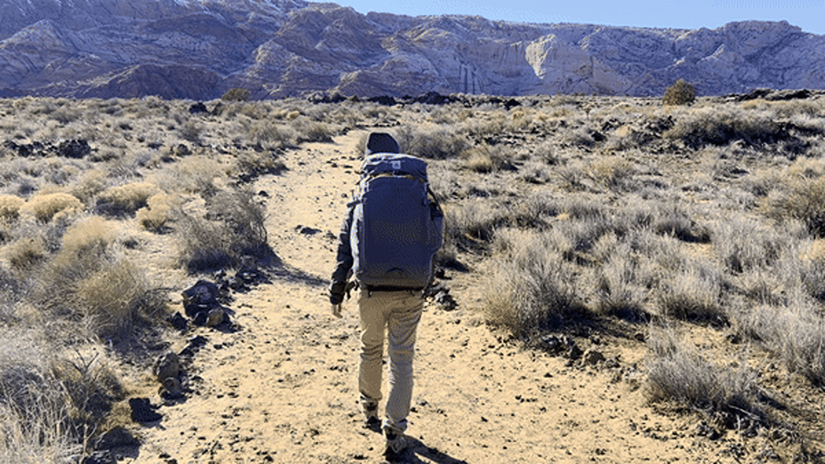 Abigail using The Backpacker by Salkan on a trail hike