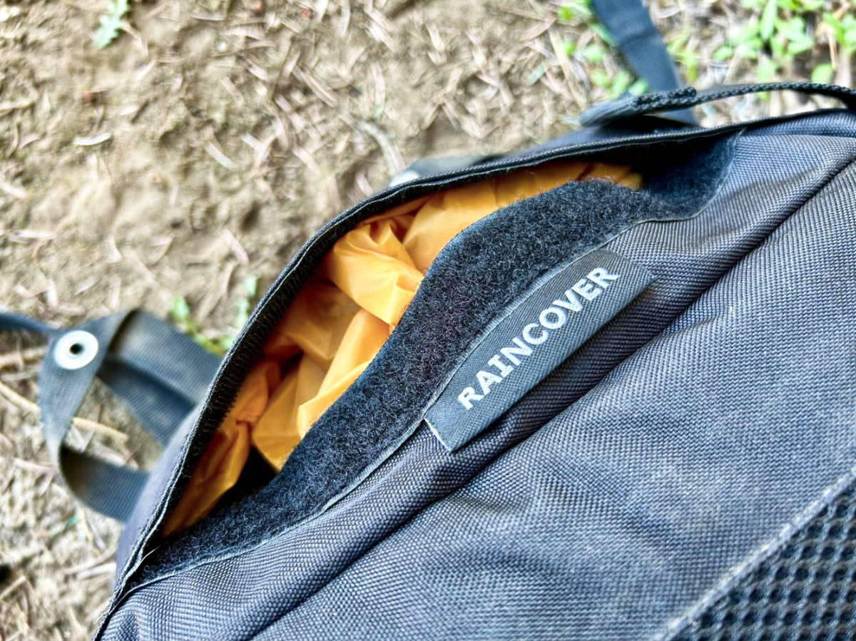 View inside the exterior pocket with a rain cover