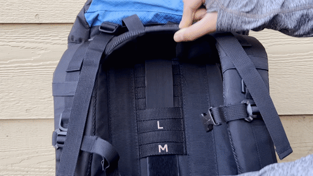 A demonstration of the torso height adjustment of the Teton Sports Scout Backpack