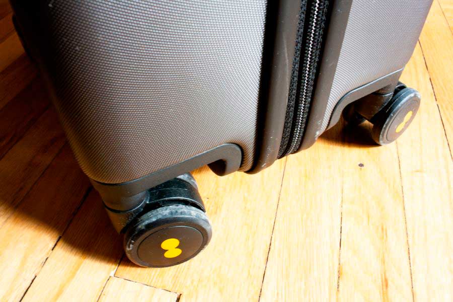 Close up view of the spinner wheels of the Textured Carry On