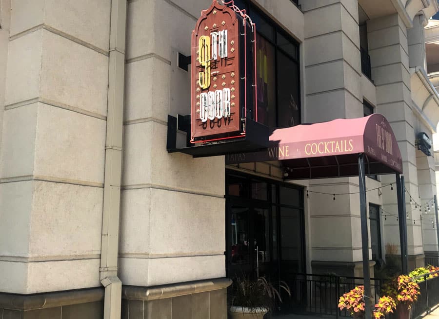 The 9th Door signage at the entrance