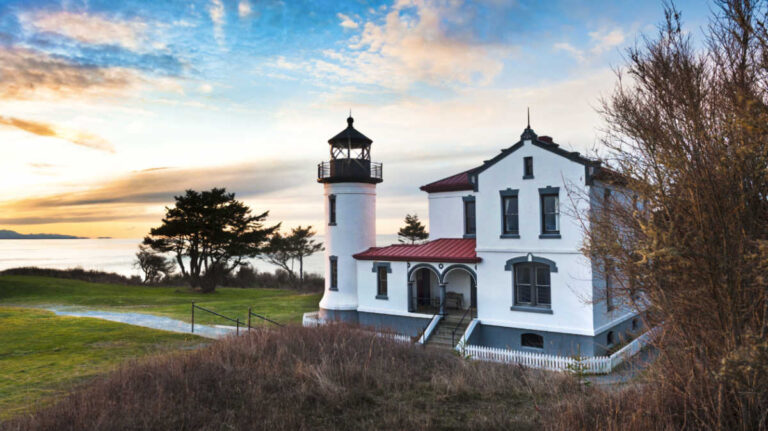 Exterior view of The Admiralty Head Lighthouse with the scenic view of the sunrise