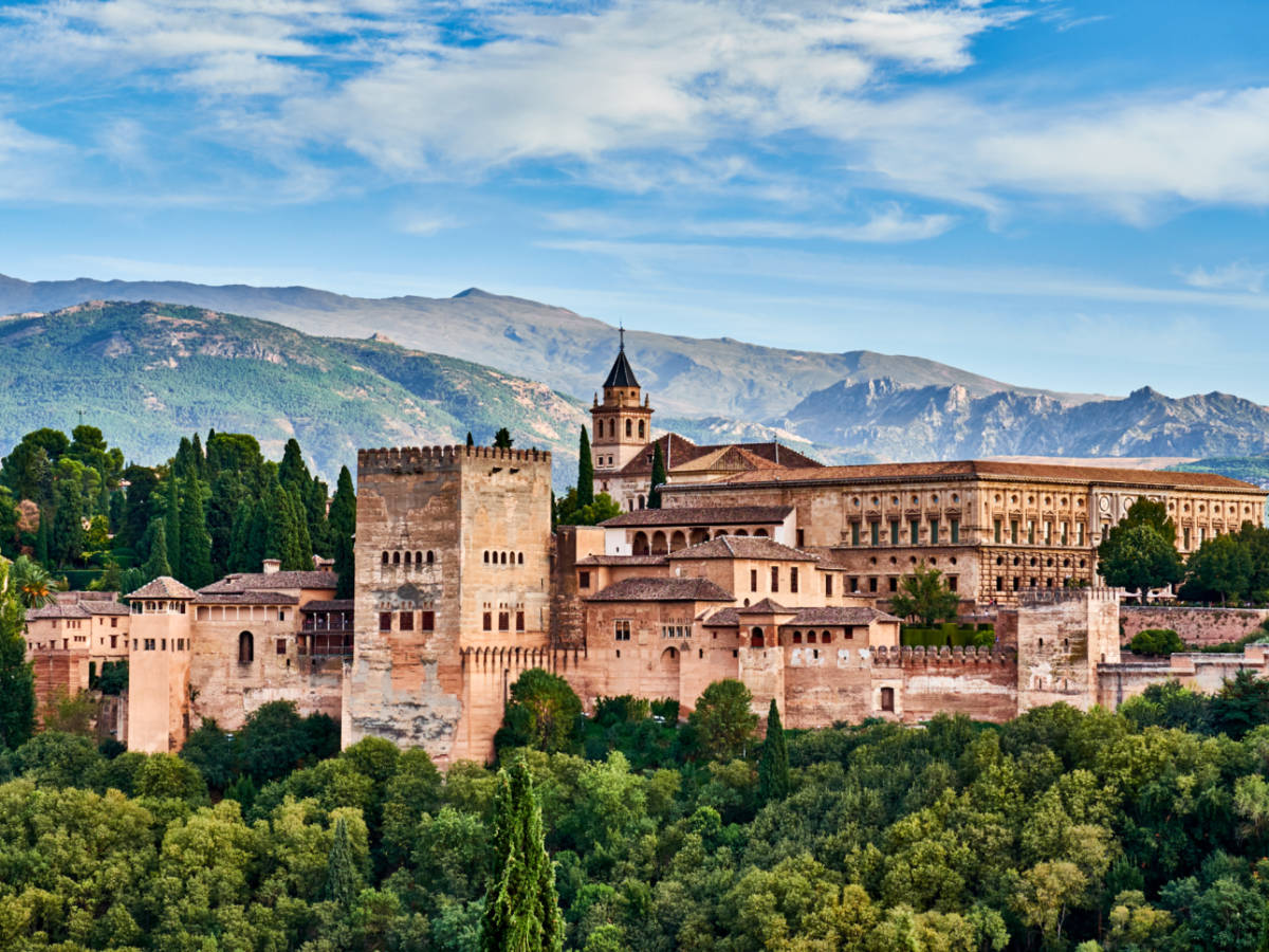Aerial view of The Alhambra fortress surrounded by greenery