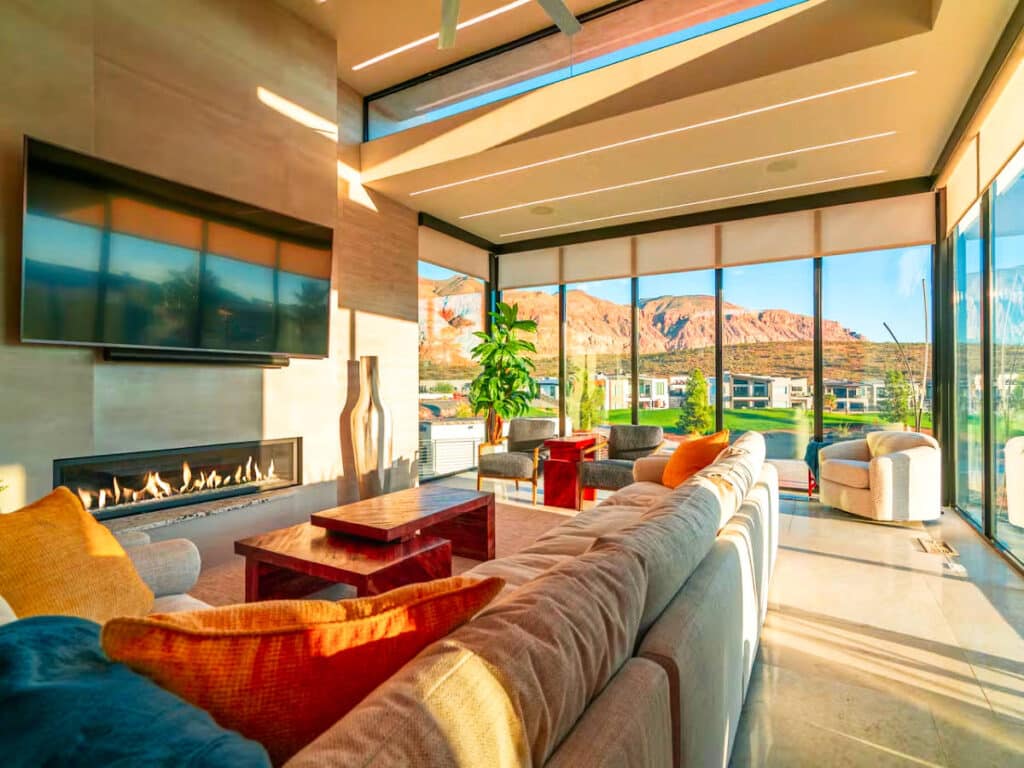 Interior view of the lounge area with vibrant accent pillows of an All-American home rental in Washington County, St. George