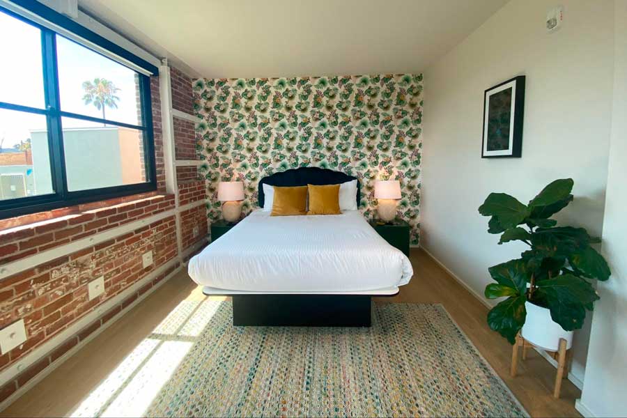 View of a bed in a bedroom in The Brick Hotel