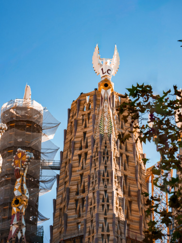 Closeup view of the dove sculpture on one of the towers at La Sagrada Familia