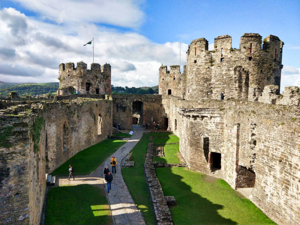 Overlooking view of the people admiring the ruins of Conwy Castle