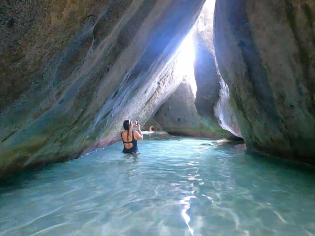 A woman at one of the secret pools at The Baths
