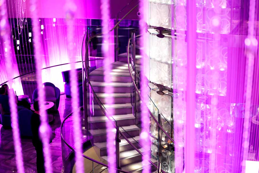 View of a staircase going to The Chandelier bar