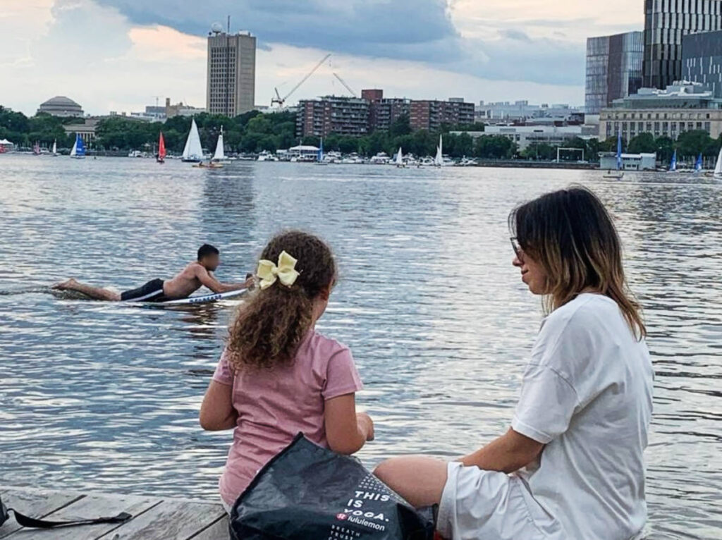 The author Claudicet Pena with her daughter enjoying their day by the Charles River