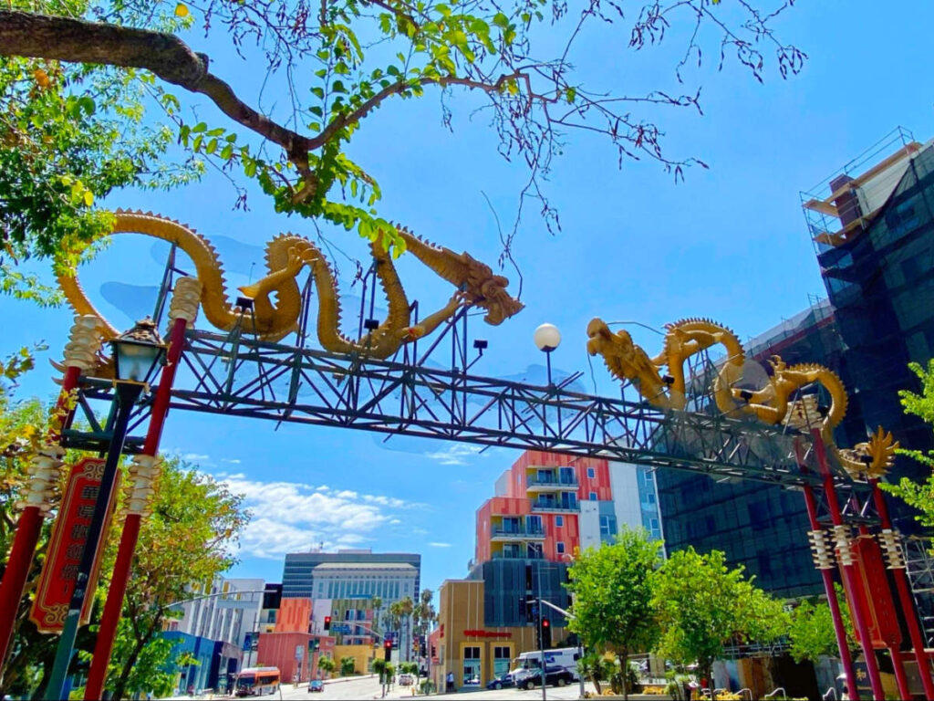 A dragon-adorned gate stands at Chinatown Gateway Monument.