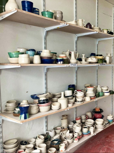 View of the clay pots on the shelves in The Clay Atelier