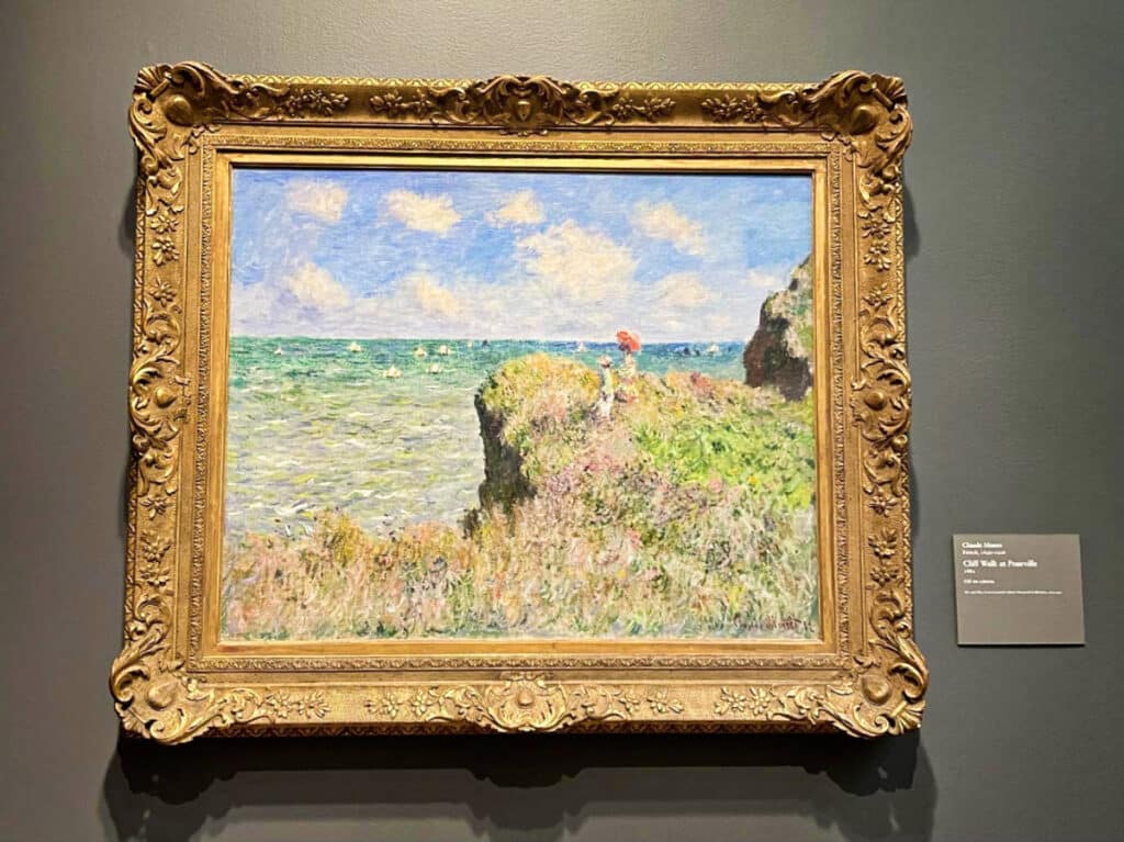 Closeup look of the painting of The Cliff Walk at Pourville by Monet displayed at the Art Institute