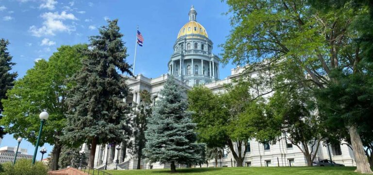View of The Colorado State Capitol surrounded by trees