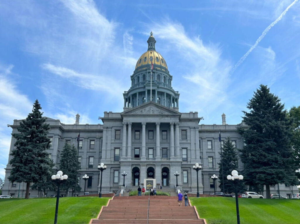 The Colorado State Capitol Building under the clear blue sky from the outside