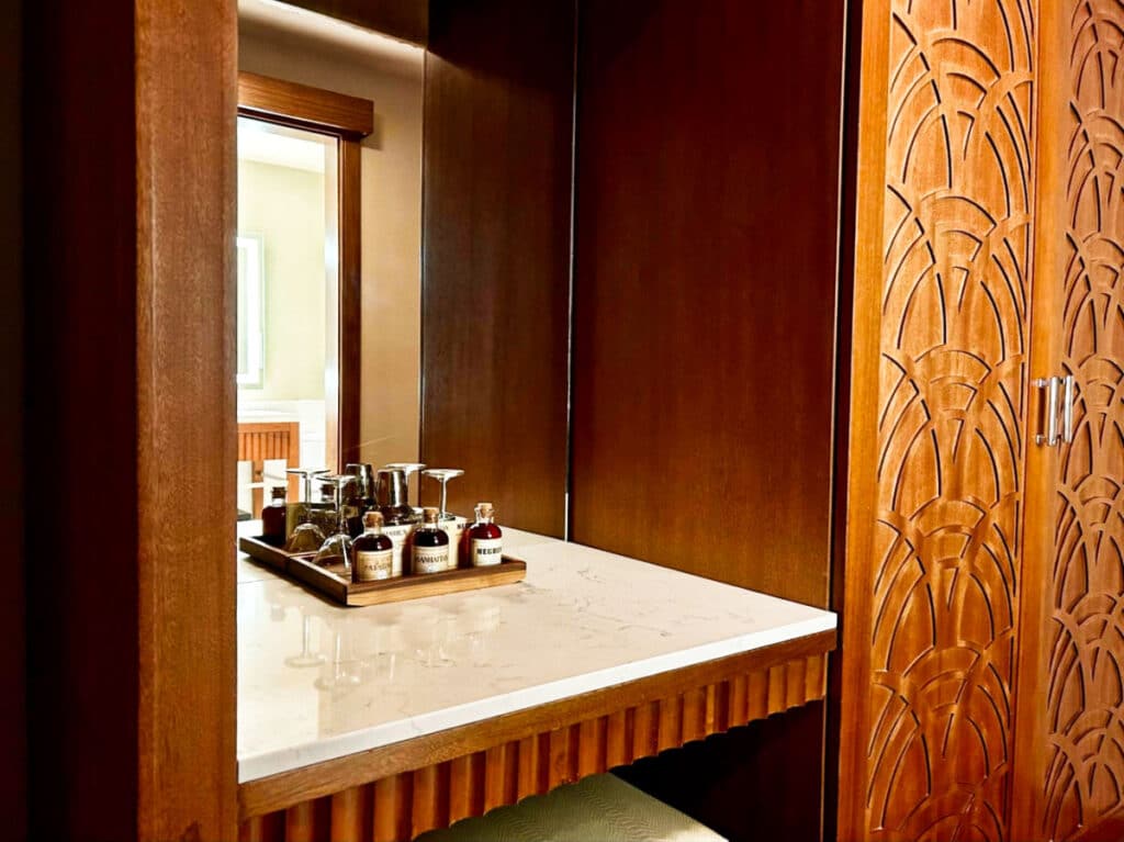 The vanity area with complimentary drinks in The Crawford hotel
