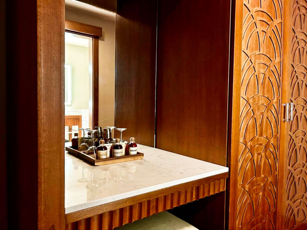 The vanity area with complimentary drinks in The Crawford hotel