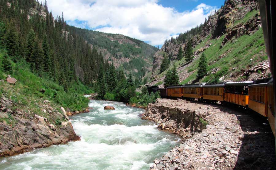 View of a rushing river while on the Durango & Silverton Narrow Gauge Railroad
