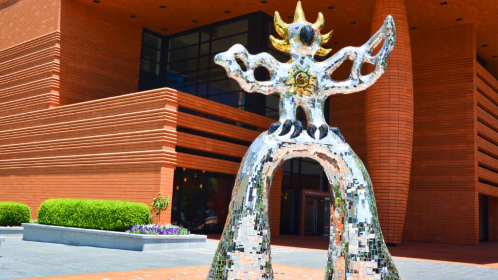 View of “The Firebird” statue in front of Bechtler Museum of Modern Art