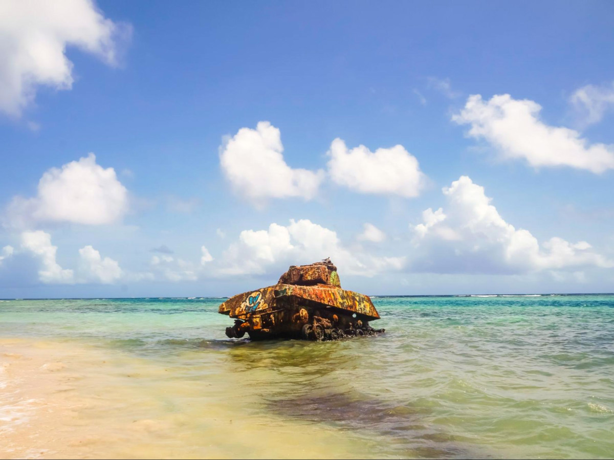 View of an old rusty tank by the beach in Flamenco Beach