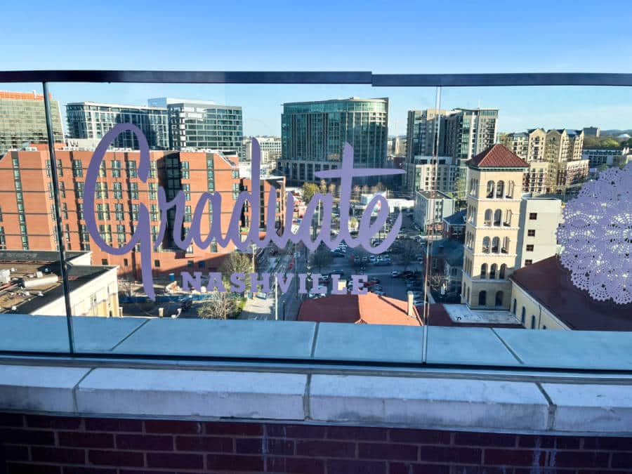 Overlooking view of the tall buildings from The Graduate Nashville balcony