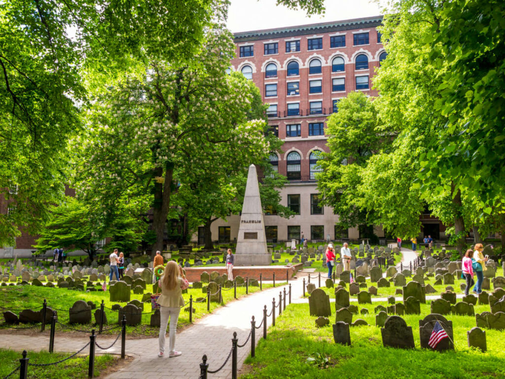 People visiting the graves at the Granary Burying Ground in Boston