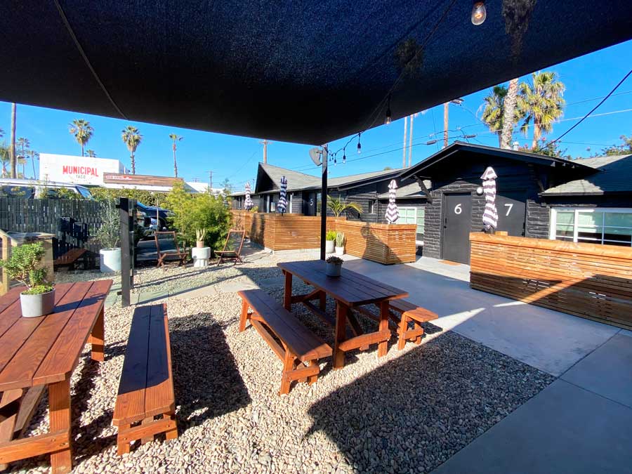 View of tables and chairs on the outdoor area in The Green Room
